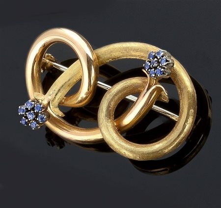 SPILLA Spilla in oro giallo, lucido e satinato, a motivo di intreccio...