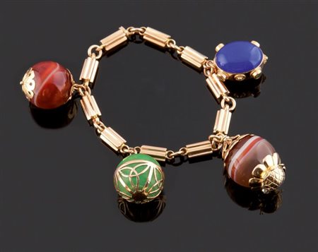 BRACCIALE Bracciale in oro giallo, lavorato a cilindri, recante quattro...