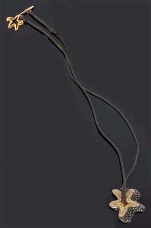 VALTER FRANCO RICCI Ciondolo in oro rosa, firmato "Ricci", a forma di stella...