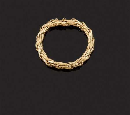 HERMES Bracciale in oro giallo, firmato "Hermes", lavorato a maglie...