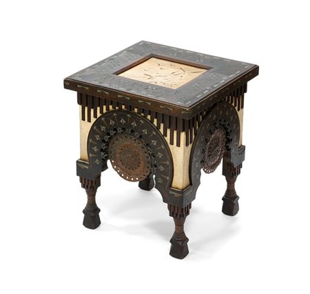 BUGATTI CARLO Tavolino con struttura rivestita in pergamena e rame sbalzato....