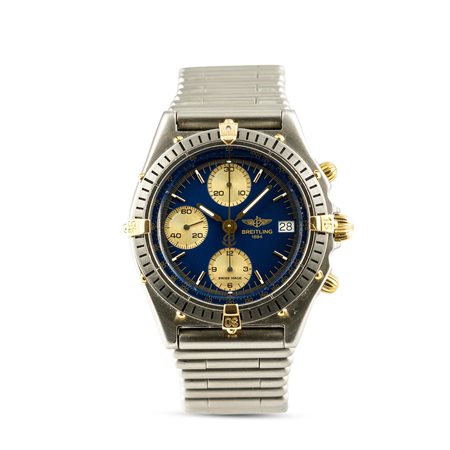 BREITLING - Chronomat acciaio e oro, ref B13047, bracciale Rouleaux con quadrante blu