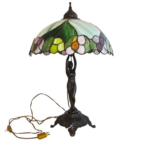 Lampada stile Tiffany base in metallo brunito, fusto raffigurante figura...