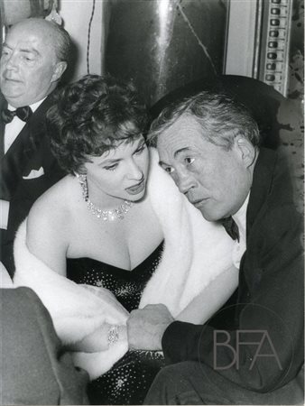  Gina Lollobrigida and John Huston.