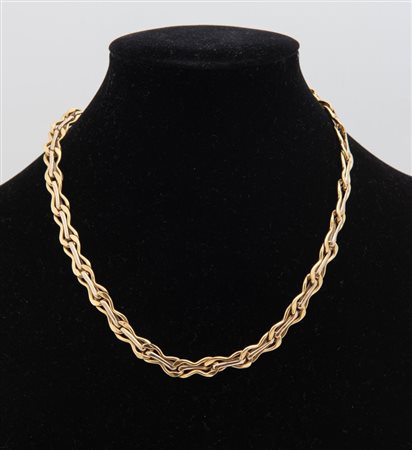 COLLANA IN ORO GIALLO E BIANCO. Realizzata come un collier articolato in...