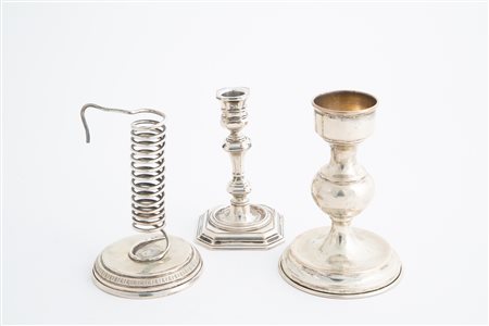 Three 800 silver candelabras, gr. 680 ca. 20th c.