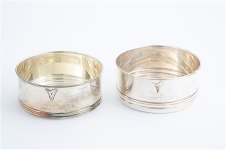 Two silver coasters, gr. 415 ca. Caimi Cup