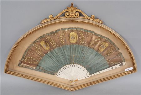 Silk fan with golden decorations. 19th century