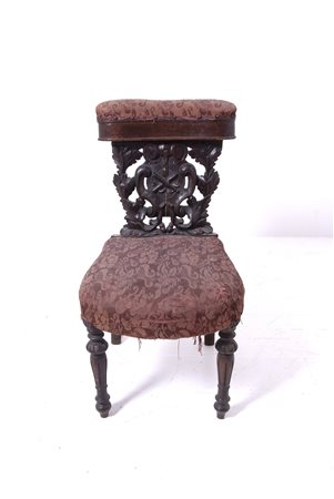 Wooden engraved chair. 19th century