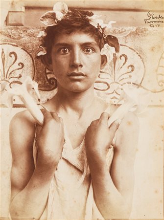 Wilhelm von Gloeden (1856-1931)  - Youth with lotus flowers, 1910