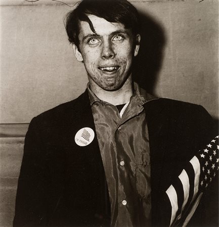 Diane Arbus (1923-1971)  - Patriotic Young Man with a Flag, N.Y.C., 1967