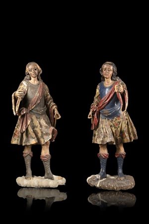 Coppia di sculture fiorentine reggitorciera in legno laccato e dorato raffigura