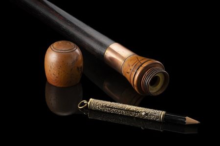 Bastone da viaggiatore in legno ebanizzato con pomolo a bulbo celante una busso