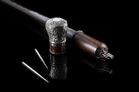 Bastone da dentista in ebano con pomo in argento sbalzato a volute fogliate