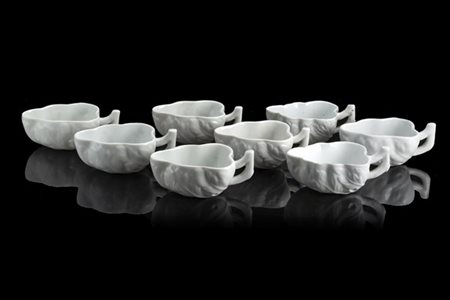 Manifattura di Ginori, secolo XIX. Lotto di otto cremiere in porcellana bianca