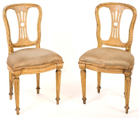 Coppia di sedie in legno laccato, fine del XVIII secolo dorate lungo i...