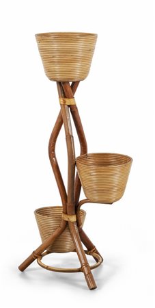 UNA FIORIERA, anni "60. <br>Malacca, giunco. 