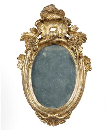 Specchiera ovale in legno intagliato e dorato a mecca. XVIII secolo Decori...