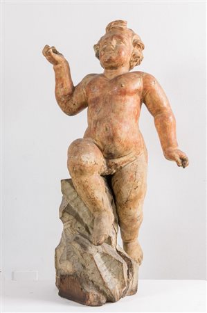 GRANDE PUTTO in legno con tracce di doratura. Roma, fine del XVII secolo -...