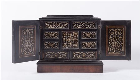 PICCOLO STIPO MONETIERE lastronato in ebano con intarsi in avorio. Lombardia,...