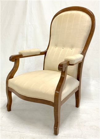 Poltrona con gambe e braccioli mossi. Secolo XIX