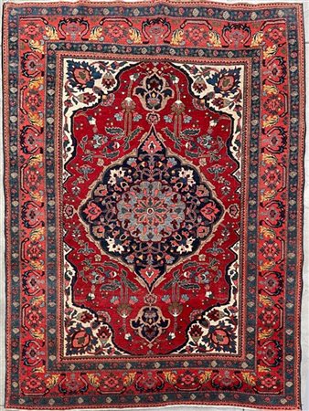 Tappeto Ferahkan-Sarouk, Persia, inizio secolo XX. Decoro con medaglione blu co