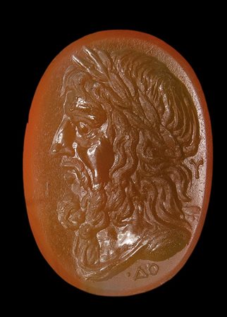 An important greek agate intaglio. Bust of Zeus with letters.