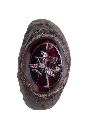 A rare roman garnet intaglio mounted on a iron ring. Working ant.