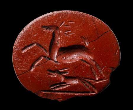 A roman red jasper intaglio. Hunting scene.