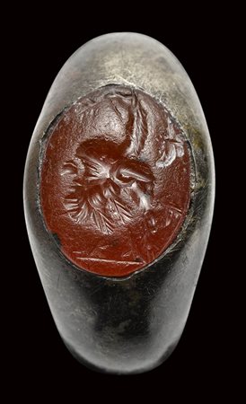 A roman carnelian intaglio mounted on a silver ring. Gryllos. 