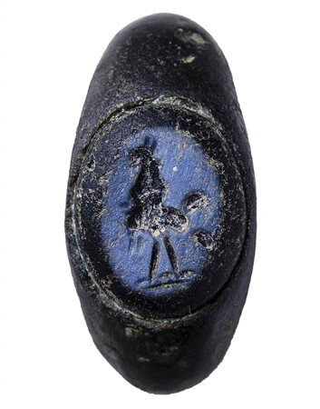 A roman silver ring set with a glass intaglio. Gryllos.