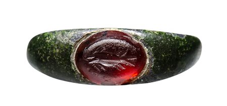 A roman bronze ring with carnelian intaglio. Fish. 