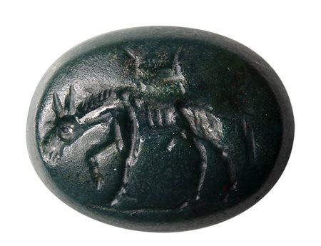 A roman green jasper intaglio. Ithyphallic donkey and latin letters. 
