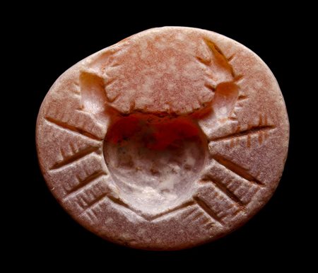 A roman burnt carnelian intaglio. Crab.