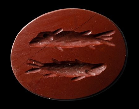 A roman red jasper intaglio. Pisces.