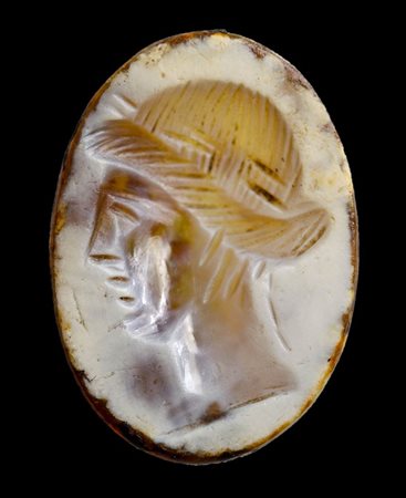 A roman burnt agate intaglio. Head of Apollo.