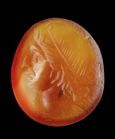 A roman agate carnelian intaglio. Head of a Dioscure.