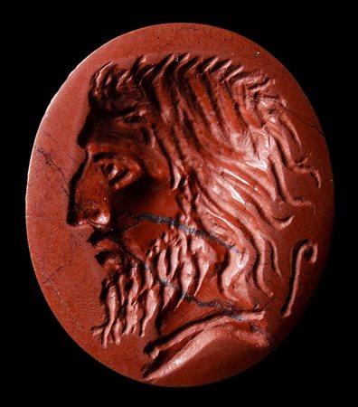 A  roman late  republican red jasper intaglio. Portrait of a Barbaric character with lituus. 