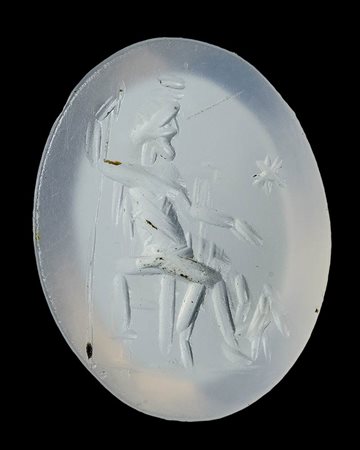 A roman chalcedony intaglio. Serapis enthroned with Cerberus. 
