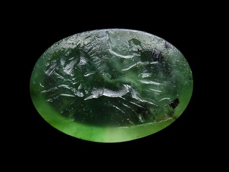 A roman green chalcedony intaglio. Biga. 