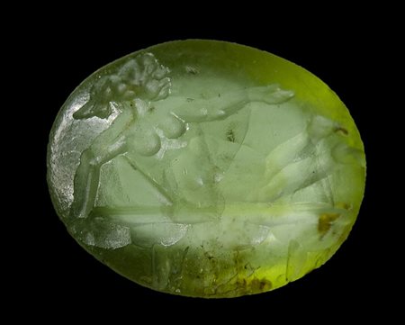 A roman peridote intaglio. Naked woman on a Kline.