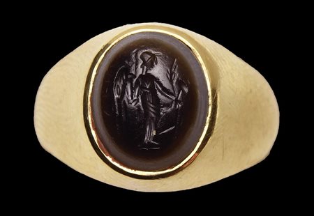 A roman two-layered agate intaglio mounted in a modern gold ring. Fortuna-Tyche. 