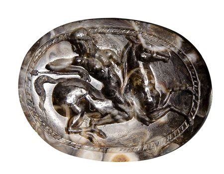 An italic fossilized chalcedony scarab. Horseman. 
