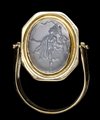 A roman chalcedony intaglio set in later gold swivel ring. Dancing satyr.
