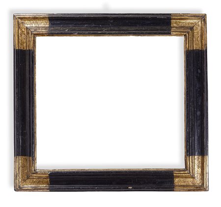 Cornice in legno ebanizzato e angoli dorati e bulinati. Toscana XVII secolo