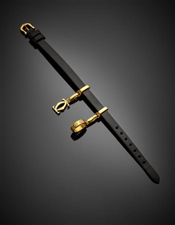 CARTIER
Bracciale in pelle con un charm "Love" e un charm con "C" incrociate, c