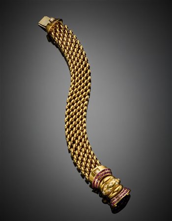 Bracciale in oro giallo a fascia intrecciata con chiusura a fiocco rifinita in