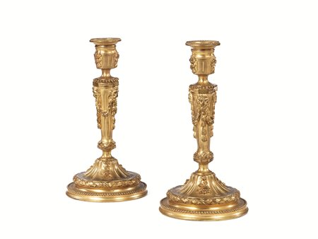 Coppia di candelieri, seconda metà sec. XVIII, in bronzo dorato, fusto a...