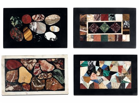 Gruppo di quattro presse papier in commesso di marmi e pietre dure. XX secolo