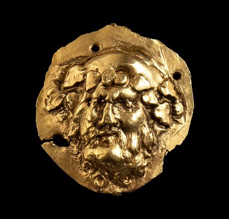 APPLIQUE ELLENISTICA DIONISIACA IN OROca. 200-150 a.C.Oro, gr 6,30; alt. mm...